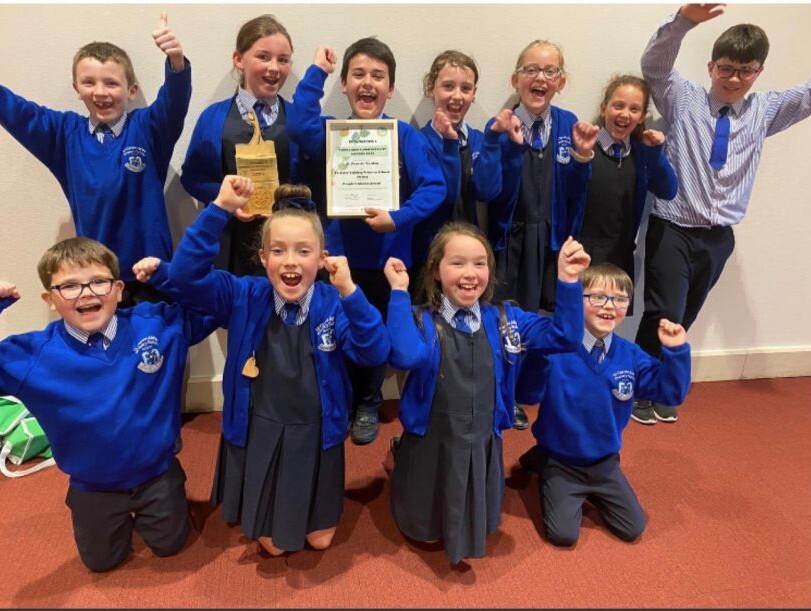 Pupils from St Clare's Abbey PS celebrate their win.
