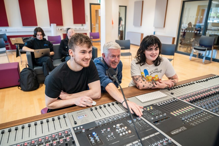  Students at work alongside lecturer Paddy Craig
