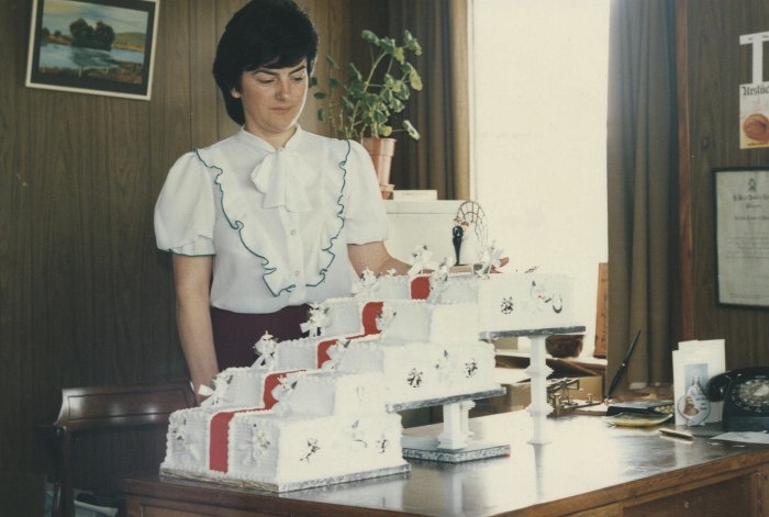 Cecelia McKey, an officer worker, pictured with a wedding cake made for Tommy and Theresa Downey in the 1980s. Many local wedding couples had their wedding cake made at McCann’s. Newry and Mourne Museum Collection