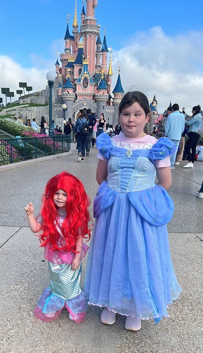 Lailah and her sister at Disneyland.
