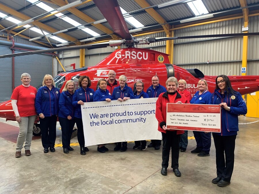Pictured presenting the cheque are from left: Helen Keating (Air Ambulance NI), Tesco Community Champions Caroline (Bangor), Ann (Bentrim), Jackie (Ballymoney), Edel (Lurgan) and Anne (Carrickfergus), David Leckey (Air Ambulance NI), Tesco Community Champions Lesley (Antrim), Robert (Newtownbreda) and Donna (Yorkgate), Alison Lecky (Air Ambulance NI), Heather Theunissen (Air Ambulance NI) and Tesco Community Champion Kym (Crumlin). 