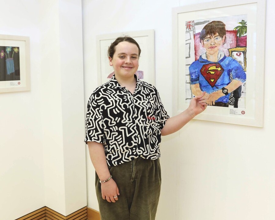 Alfie Whyte from Cloghogue with his painting on display at an exhibition in Omagh this month.
