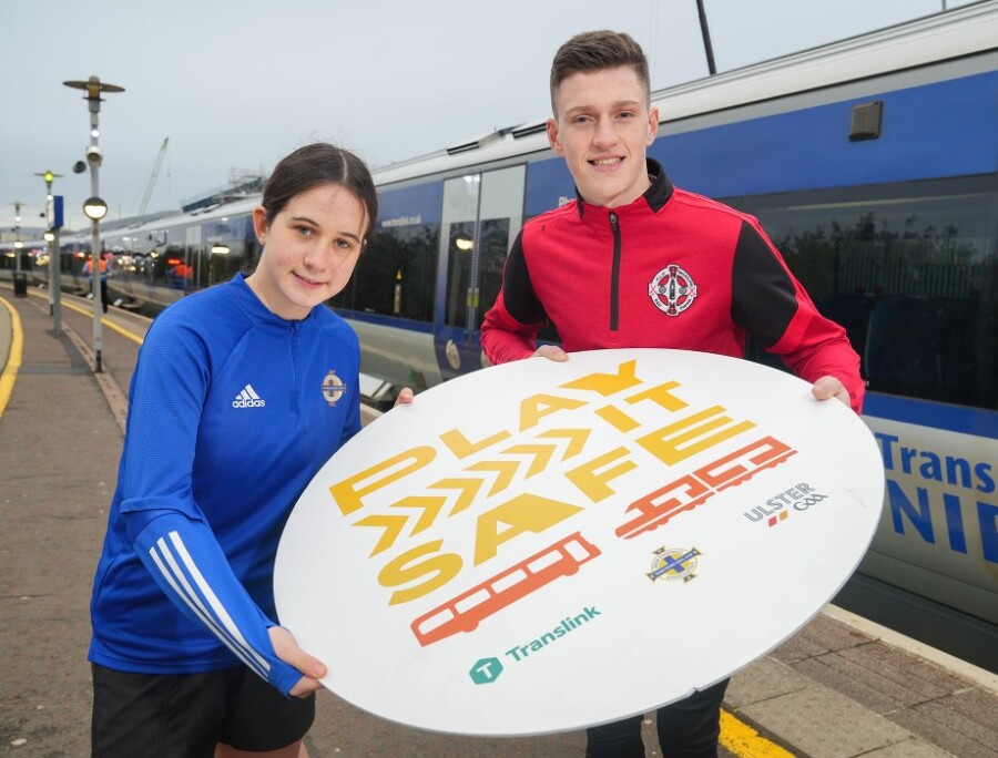 Translink says 'Play It Safe' - promoting safe and responsible behaviour on and around public transport this summer. Pictured are Anna, Irish FA youth player and Ulster GAA youth player Séan Óg.