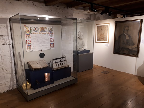 The portrait on display at Newry and Mourne Museum. The letters patent granting Sir Charles Russell his peerage can be seen in the display case on the left.