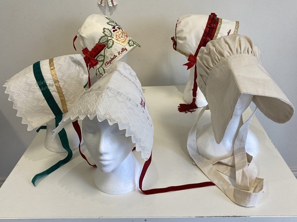 A display of bonnets at the exhibition honouring the lives of the thirty five girls who left Newry Workhouse.