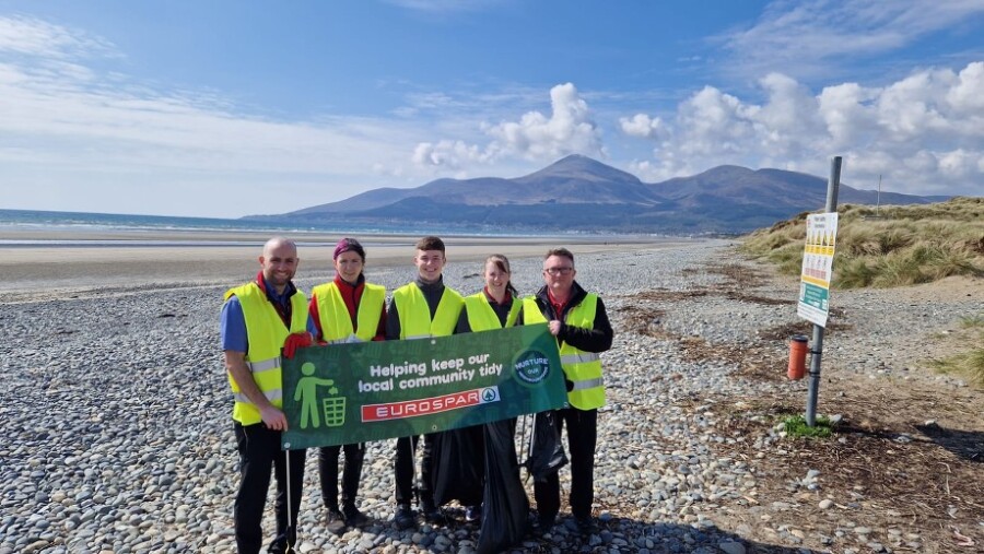 The team from EUROSPAR Clough cleaning up the beach