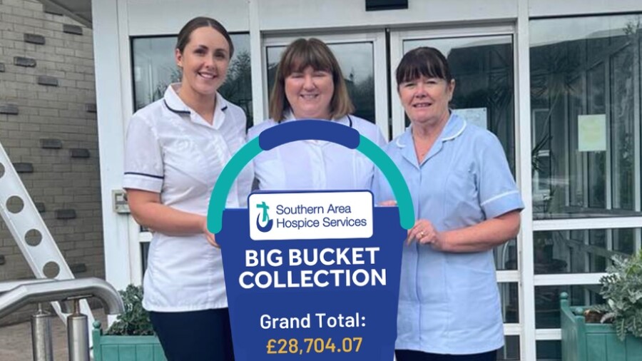 Olivia Rooney (Specialist  Occupational Therapist), Emma Rodgers (Allied  Health Professional Lead) and Angela Fegan (Nursing  Auxiliary) proudly display the total raised at the 2024 Big Bucket Collection for the Hospice.