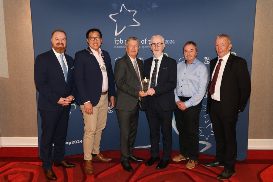 IPB Insurance CEO John Kearns, third from left presents the runner up award in the Community Well-Being Initiative category of IPB Pride of Place to Cllr David Lee-Surginor, Deputy Chairperson, Newry, Mourne and Down District Council  and Cuan Mhuire members.