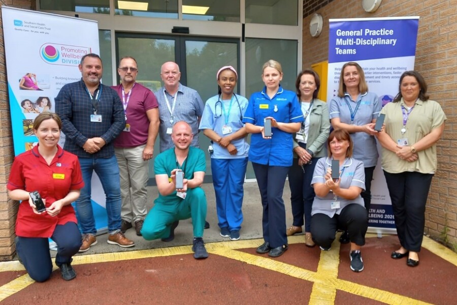 Daisy Hill Hospital’s ED team have welcomed delivery of new pocket sized translation devices to improve how they communicate with patients who do not speak English as a first language. Back l-r Robbie McCague, Inequalities and Inclusion Co-ordinator, John Flett, MDT Social Work Assistant, Maurice Rocks, Traveller and Ethnic Minority Support Worker, Dr June Okojie, GP Specialist Trainee, Alex Logina, Clinical Sister, Helen McCaul, ED Administration Manager, Fiona Finnerty, ED Admin, Deirdre Magill, MDT Project Manager. Front l-r Sr Lisa Small ED Ward Manager, Dr Paul Webster, ED Consultant and Lorraine Magill, ED Administration Supervisor.  