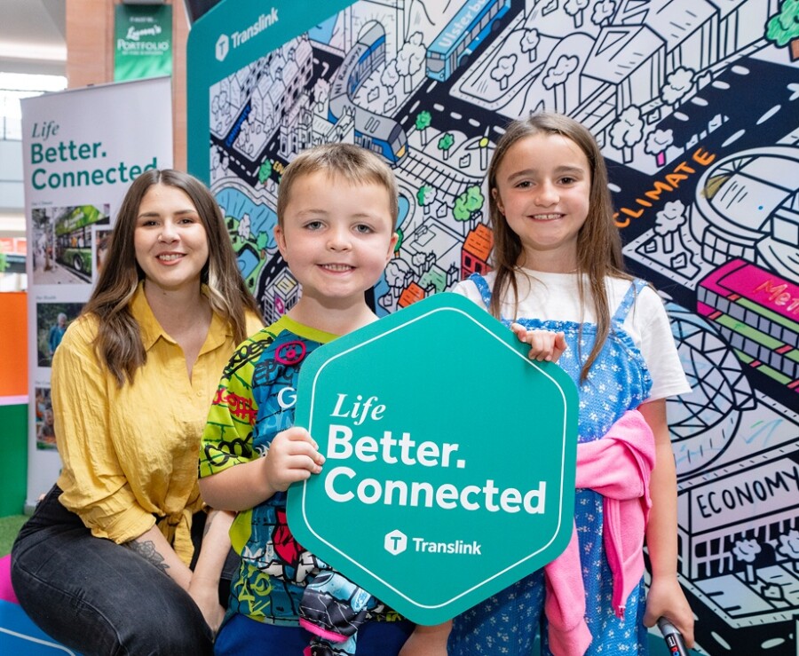 Street artist Danni Simpson pictured with budding young artists James and Katie launching the Translink Life Better. Connected campaign.