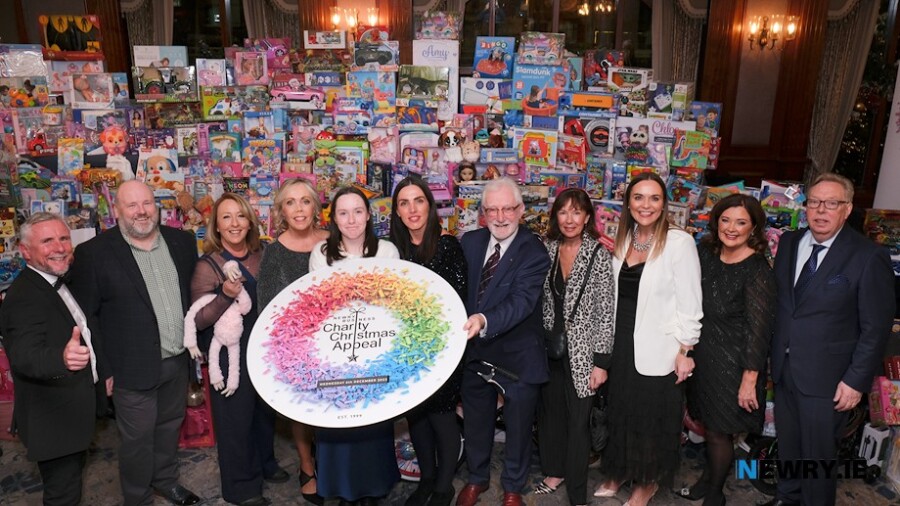 The organising committee pictured in front of the massive toy mountain at the Newry Business Christmas Charity Dinner in the Canal Court Hotel. Photograph: Columba O'Hare/ Newry.ie