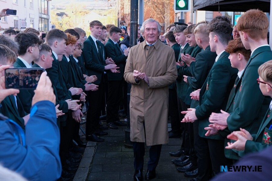 Pat Jennings walks through a St Joseph's High School guard of honour at the unveiling of his statue today. Photograph: Columba O'Hare/ Newry.ie 