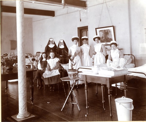 Two sisters from the Order of St John of God pictured with nurses and patients in one of the wards at Newry Union Infirmary and Fever Hospital at Daisy Hill in 1912. The Sisters of St John of God remained at Daisy Hill until 2000 when the last Sister working there retired. Newry and Mourne Museum Collection