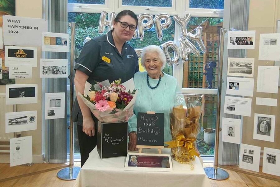 A Southern Trust staff member pictured with Maureen O'Hare.