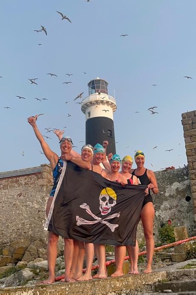 Celebrating at Rockabill Lighthouse. From left: enn Fitzgerald Oonagh Garry Georgie Lonton Andrea Judge Edele Johnston Lauren O’Malley