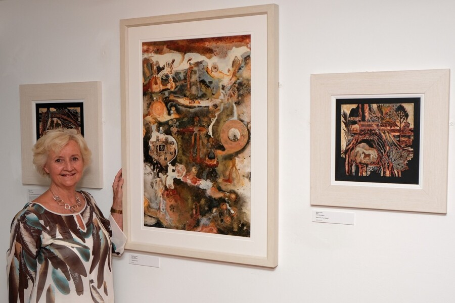 Artist Cora Harrington pictured with her paintings at the opening of the Newry Artists Past and Present exhibition in Newry and Mourne Museum.