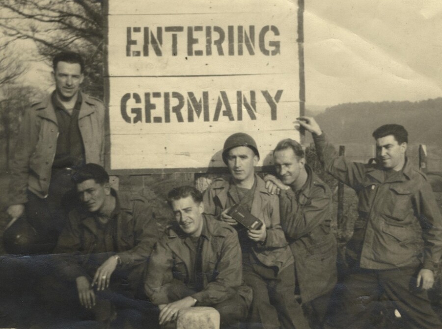 James Quinn (third from right, holding a camera) and comrades entering Germany. Newry and Mourne Museum Collection