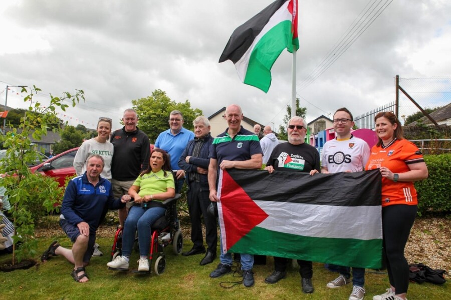 The Sloan family with Pat McGinn, Breandán Lewis and some of the elected representatives who attended the event