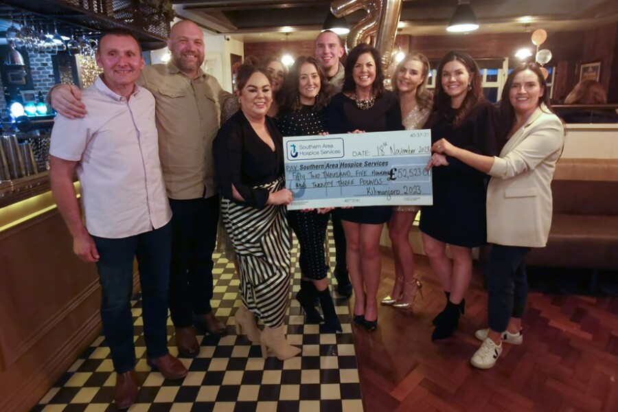 Fundraising Officer, Laura Rowntree from Southern Area Hospice received the Cheque from members of the Happiness Place Hiking Group