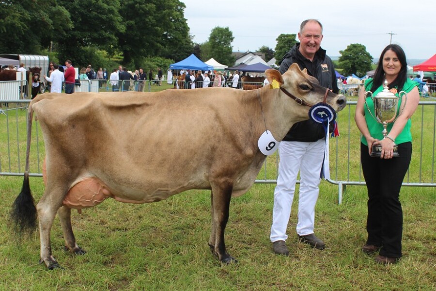 The dairy inter-breed champion with owner Ashley Fleming and judge: Leiza Montgomery