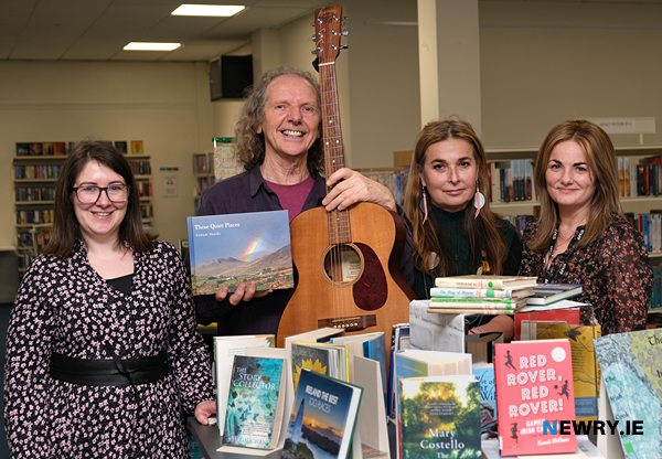 Colum Sands launches his new book These Quiet Places at Warrenpoint Library. Also included are library staff, from left: Elaine Toal, Natasha Stokes and Lorraine Grimley. Photograph: Columba O'Hare/ Newry.ie