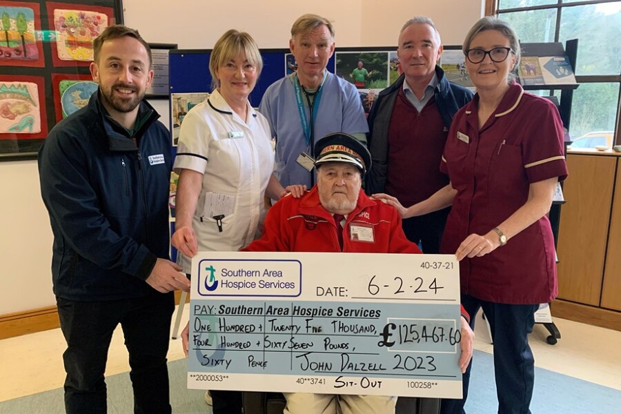 John Dalzell OBE presents a cheque for £125,467.60 to staff from Southern Area Hospice. Pictured are: John Dalzell OBE, with from left: James McCaffrey, Fundraising Officer; Mary Armstrong, Specialist Physiotherapist; Dr Osmond Morris, Lead Consultant; Damien Hillen, Director of Development; and Louise Stewart, Interim Inpatient Services Manager from Southern Area Hospice.