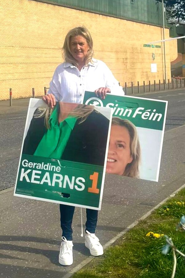 Cllr Geraldine Kearns with one of the damaged election posters.