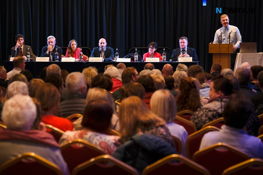 Dr Conor Patterson speaking to a packed house at the Canal Court Hotel with the panel looking on. Photograph: Columba O'Hare/ Newry.ie 