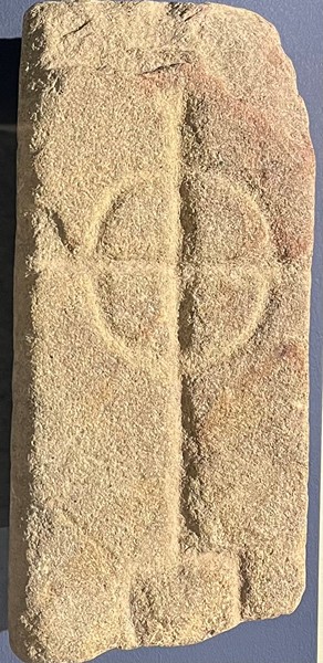 Stone with a carving of a cross dating from the Early Christian period, found at Aughnacavan, a townland beside Donaghmore Parish Church. Lent by the Ulster Museum, the stone is on display in Newry and Mourne Museum.