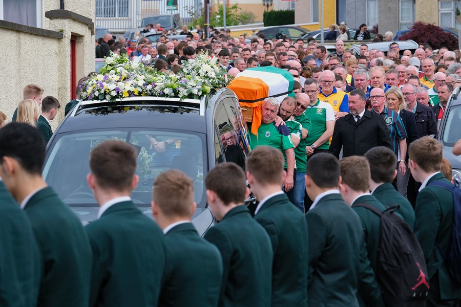 St Joseph's High School pupils form a Guard of Honour for the Funeral cortege.