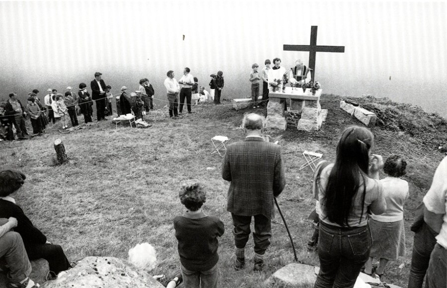 Mass being celebrated in the1980s at Altataggart mass rock, outside Hilltown, Co. Down.  © Sean Hillen