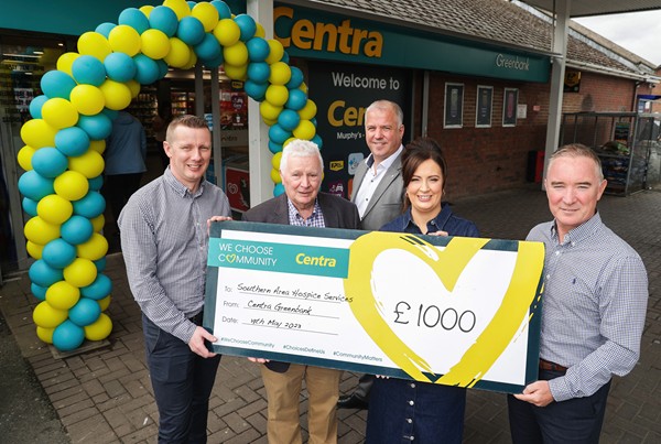 To mark the launch of the new look Centra Greenbank store in Newry, Musgrave NI Retail Sales Director Paddy Murney (centre) joins family owners (from left to right) Declan Murphy, Seamus Murphy and Niamh Browne, who present Damien Hillen from the Southern Area Hospice Services with a donation of £1,000.