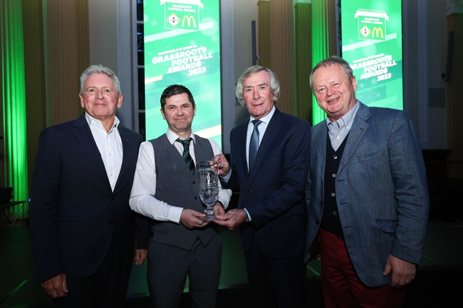 John McCollum (McDonald’s franchisee), Jude McLaughlin (2023 People’s Award winner), Pat Jennings and Des Lamph (McDonald’s franchisee) at the 2023 McDonald’s Irish FA Grassroots Football Awards ceremony