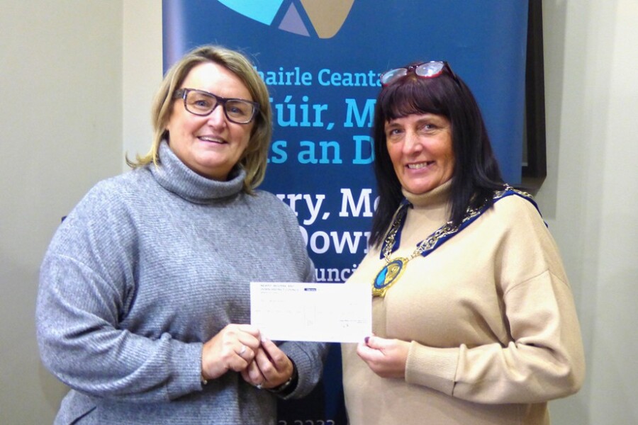 Newry, Mourne and Down Council Chairperson, Councillor Valerie Harte presents a cheque to Adele Heaney, People In Need.