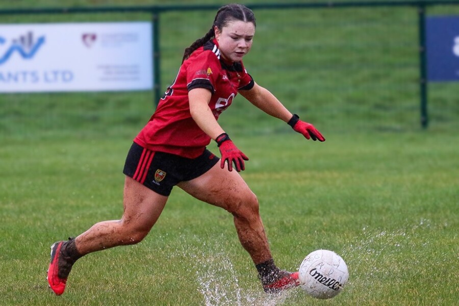 Down minor Niamh Madine get the ball despite the torrential rain. Photograph: Olivia McConaghy
