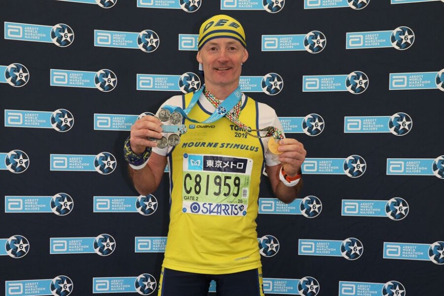 Damien Cunningham from Collins Aerospace in Kilkeel, has completed marathons in five of the seven continents and will complete the remaining two marathons in Australia and Antarctica later this year. Damien is pictured at the 2018 Toyko Marathon.