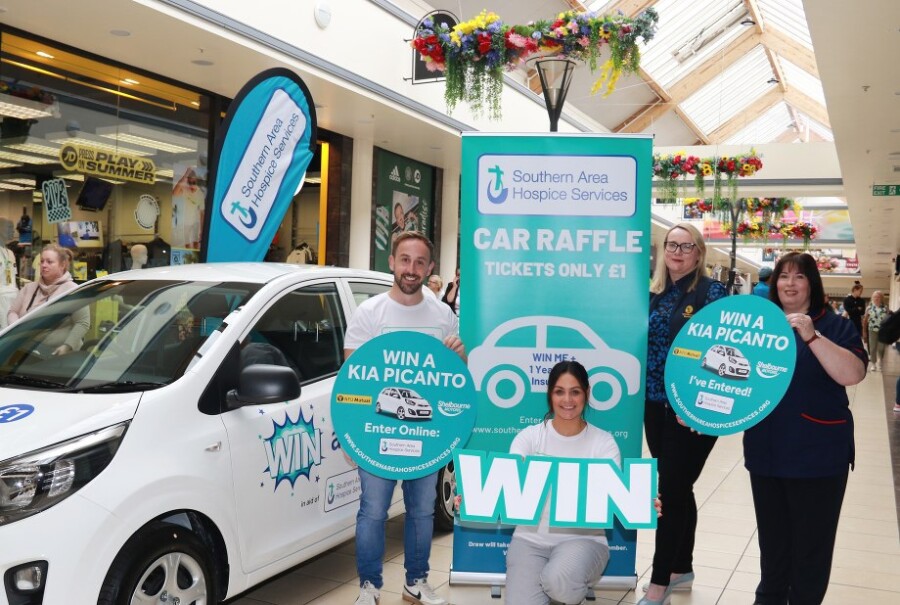 Ruth Atkins N.F.U Mutual with James McCaffrey, Sarah O'Hare and Orlath Loftus S.A.H. staff pictured with the Kia Picanto.
