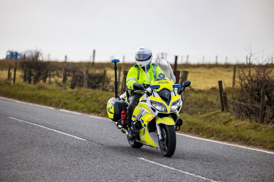 A police motorcyclist.