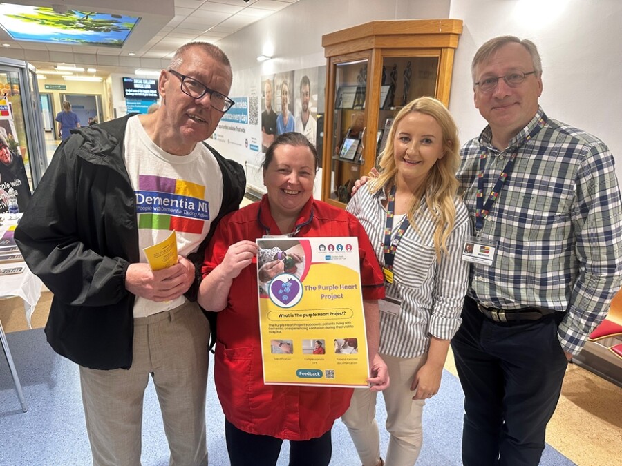 Craigavon Area Hospital ED Sister Shauna Colyer and Naoimh McGlone Service Improvement Lead for Dementia are pictured launching the Purple Heart Project with Gerard Doran and Peter Alexander, Dementia NI members who were part of the ED Quality Improvement group who developed the Purple Heart Patient leaflet.