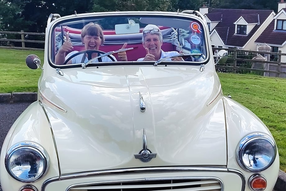 Rockfield staff Kate and Maggie try out the Morris Minor Convertible for size.