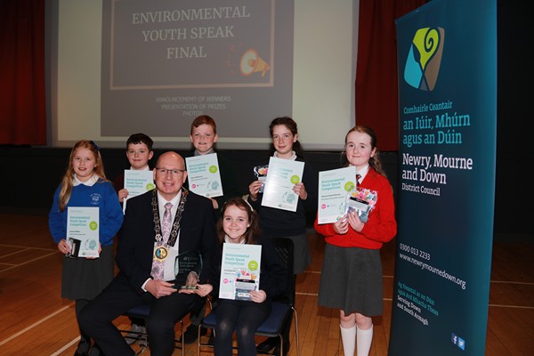 Newry, Mourne and Down District Council Chairperson, Councillor Michael Savage pictured with the junior competitors at the Environmental Youth Speak held in Newcastle.  Back Row (l-r) Finalists Louisa Gribben St. Paul's Primary School Cabra; Adhrán McCartney, St. Bronagh's Primary School Rostrevor; James McMorrow Holy Cross Primary School, Kilkeel; runners up Éilis Donnelly Annsborough, Integrated Primary School; Ramona Hamill-Davison, Sacred Heart Primary School Dundrum and winner Front Row Eva McKeown St. Moninna's Primary School, Cloughogue.