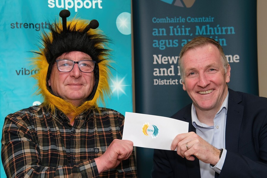 Phelim Sharvin, Community Finance Ireland presents a cheque for £1500 to Kevin Duffy, Compass Advocacy Network, Ballymoney, the winners in the Social Enterprise NI Dragons Den event hosted by Newry and Mourne Co-Operative and Enterprise Agency at WIN. Photograph: Columba O'Hare/ Newry.ie 