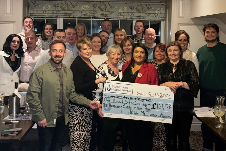 Pictured are some of the participants of the  2024 Trek Morocco who presented a cheque for £161,173.00 to James McCaffrey, Southern Area Hospice. Missing from photo are: Aisling Finegan, Tara Franklin, Dwyer O’Connor; Claire Elliott; David McCavitt; Mary McLoughlin; Annamarie O’Hare; Naiomh O’Reilly; Olivia & KatieBeth McVeigh; Francie & Kerrie Willis, Dympna Sands and Rosy Adams.