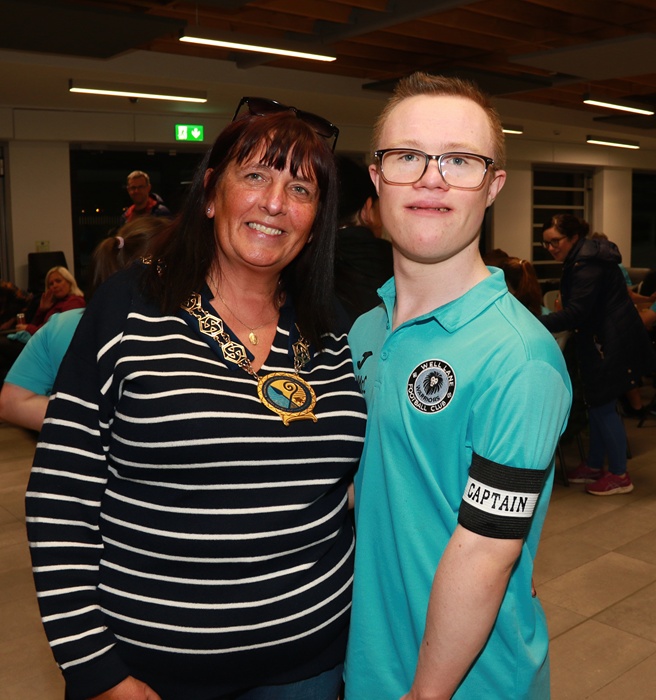 NMDDC Chairperson, Councillor Valerie Harte congratulates Micheál McCloy who recently represented Ireland in the Subs European Futsal Championship in Italy and he proudly wears his armband as Team Captain.