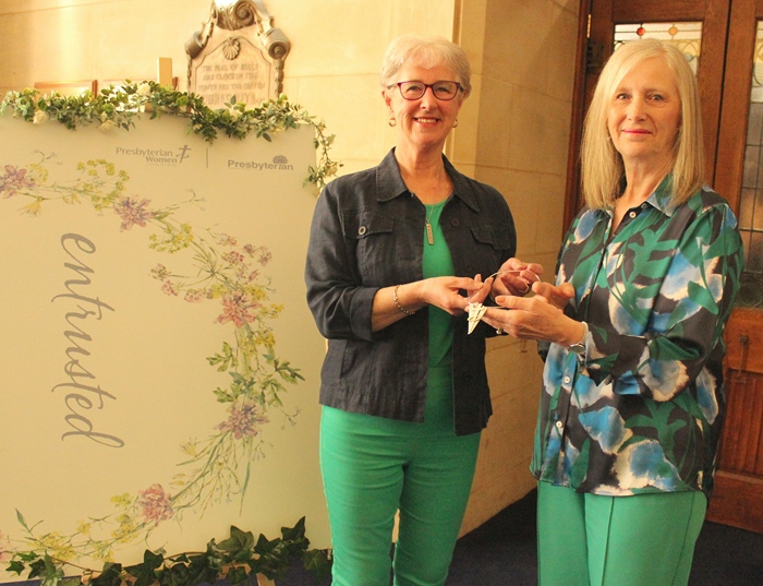 Mrs Ann Wilson (left), outgoing President of Presbyterian Women hands over the specially commissioned presidential broach, which can also be worn as a neckless, to her successor as president, Mrs Ellen Hillen.