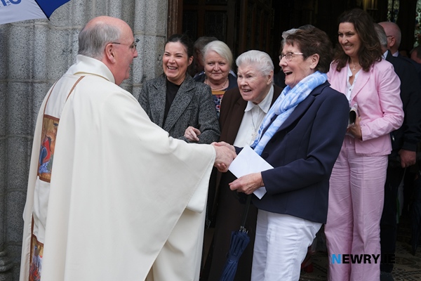 Parishioners congratulate Canon Brown.