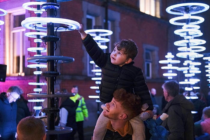 Four year old Cody McGirr gets a shoulder top viewpoint courtesy of Glenn McGirr at the launch of Illumaphonium: Halo at Sugar Island, Newry.