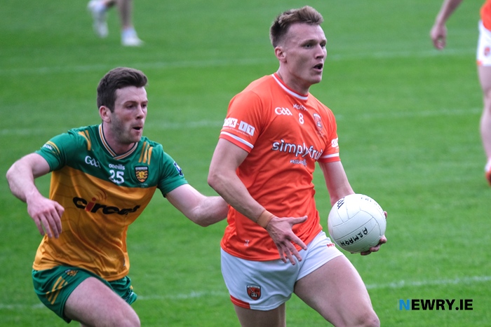 Armagh's Rian O'Neill clears away from Donegal's John Ross Molloy.