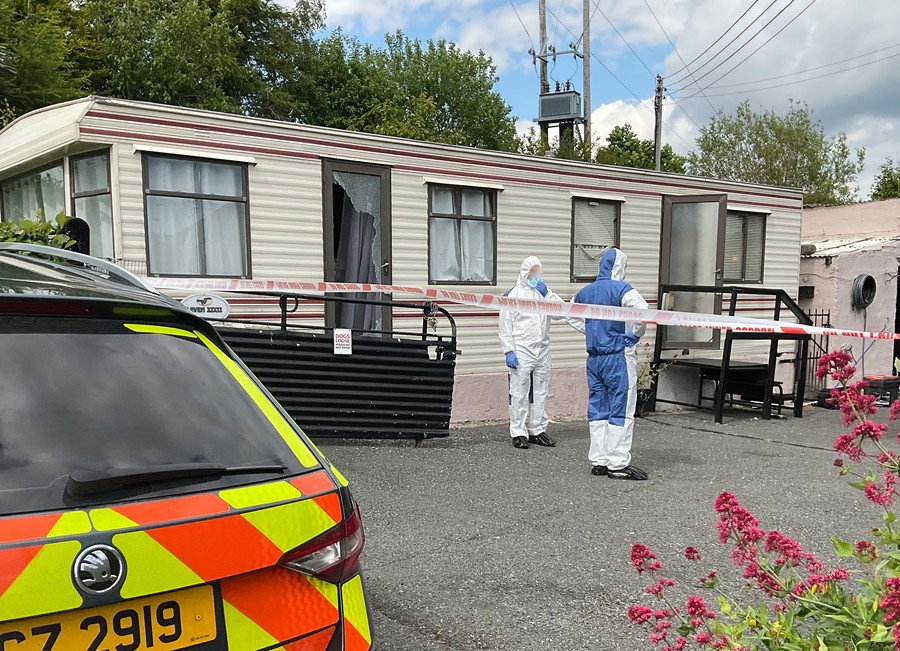 A forensic team conducting a search after the attack.