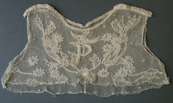 Hand-made Limerick lace bodice, from a first communion dress, c.1935. Initialled with a ‘P’, the bodice was made for Patricia McArdle by her mother, who was taught Limerick lacemaking by Sister Camillus at the Convent of Mercy, where she worked before she married. Newry & Mourne Museum Collection